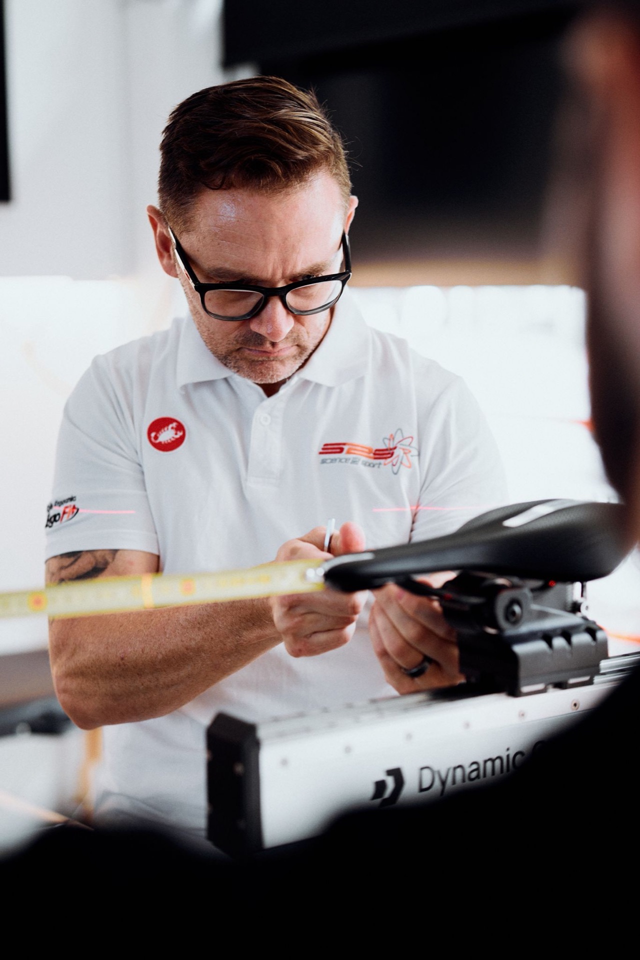 Darrel Fitzgerald measuring saddle position on the Giant Dynamic Cycling Fit system with an X-Y laser reference